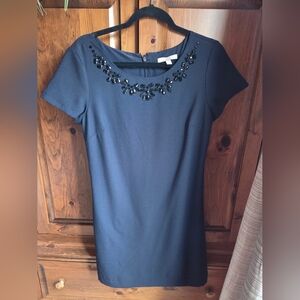 Elegant Navy Blue Dress with Embellished Neckline